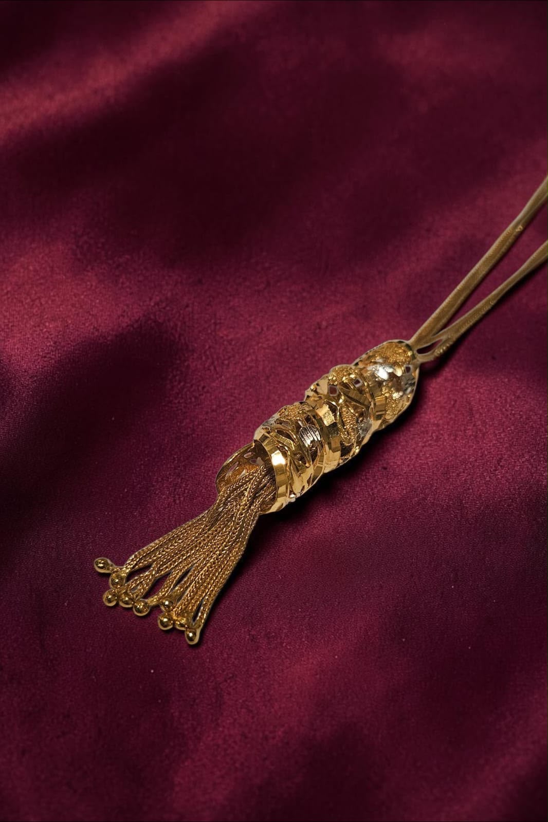 Long gold tassel pendant